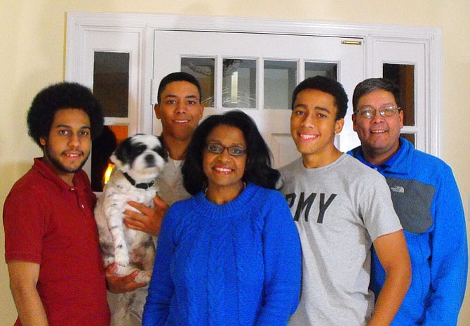 Karen Keys-Gamarra with (from left) sons Jonathan, James (holding family dog Reo) and Jordan, plus husband Antoine Gamarra.
