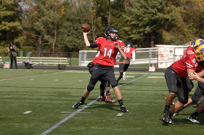 Herndon quarterback Adam Kucik throws a pass against Robinson on Saturday, Oct. 24.

