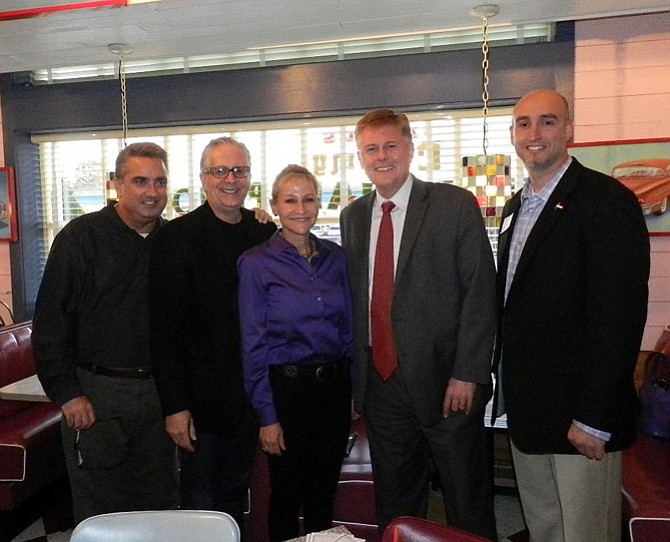 From left, City of Fairfax Mayor Scott Silverthorne, City of Fairfax Council member Michael DeMarco, Fairfax County Sheriff Stacey Kincaid, supervisor John Cook (R-Braddock) and executive director and chief executive officer of Shelter House Joe Meyer met at Chuy’s restaurant in Fairfax on Oct. 15 to raise awareness for stopping domestic violence and providing support services for domestic violence victims.