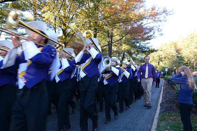 The Lake Braddock Secondary School Marching Band followed the Junior Reserve Officer Training Corps, playing the school’s fight song during the homecoming parade.