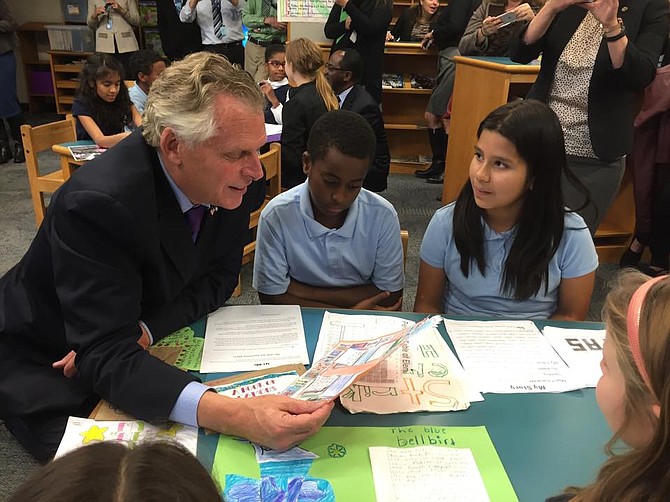 Governor Terry McAuliffe (left) with Patrick Henry students Brock Dotele (center) and Natasha Maldondo (right).