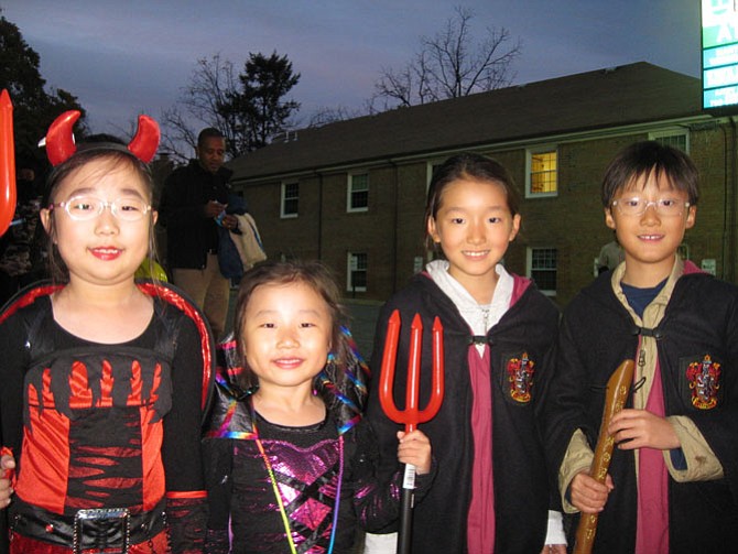 Natlyun Kim, Minju Kim, Jay Chang and Sarah Chang dressed in costumes.
