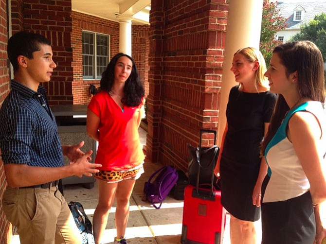 CTTL Student Research Fellows, Zein Haidir and Hope Harrison exchange ideas with Christian Hinton and Lauren Schiller of Research Schools International, Harvard University Graduate School of Education
