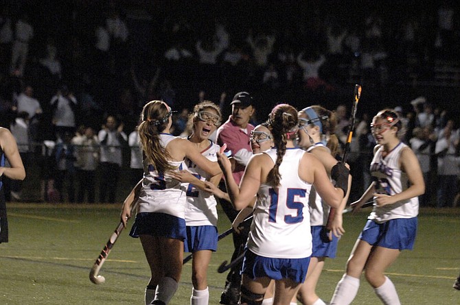 Members of the T.C. Williams field hockey team celebrate during their 1-0 victory over Fairfax during the 6A North region semifinals on Tuesday night at Minnie Howard.