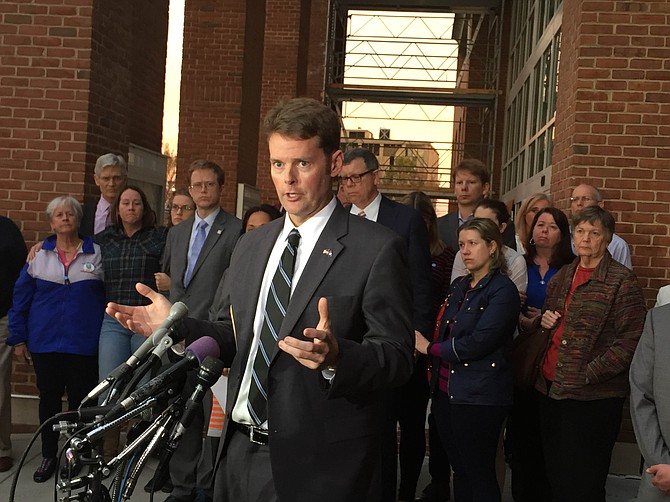 Commonwealth Attorney Bryan Porter flanked by the three families of Severance's victims.