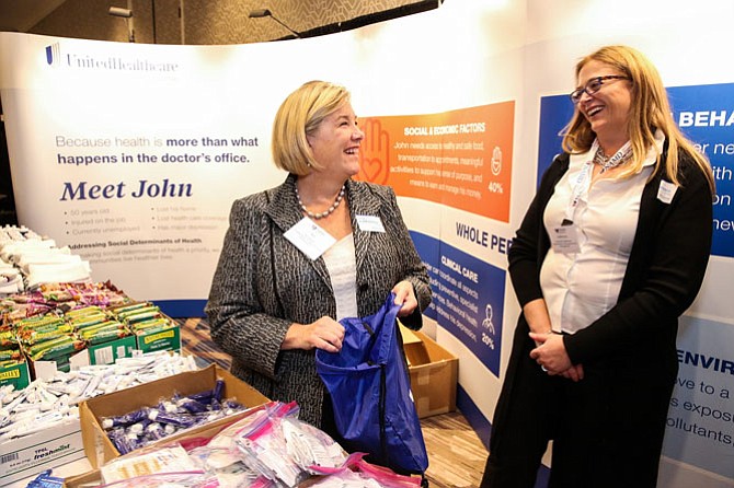 Sue Schick, chief growth officer, UnitedHealthcare Community & State and Catherine Anderson, vice president State Programs, UnitedHealthcare Community & State help UnitedHealthcare assemble 1,000 backpack care packages.
