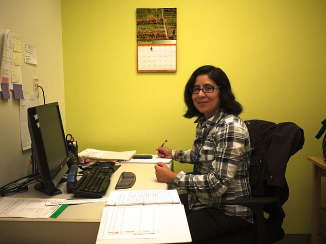 Karina Herrera at work at the newly renovated offices at 2 East Glebe Road.  Herrera is a pharm tech who has been with Neighborhood Health for about 15 years. She works in the Medication Assistance Program.
