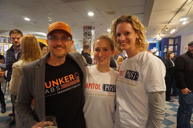 Ray Crowell of The Bunker Labs D.C., left, joins Mary Iafelice and Emily McMahan of the Capitol Post for a Veterans Day eve celebration Nov. 10 at Port City Brewery.