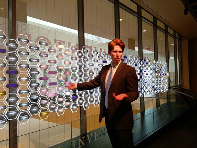 Inventors Hall of Fame historian Greg Lovas points to the names of inductees highlighted in blue to indicate their military service. A new exhibit called Visionary Veterans, which focuses on World War II veterans, opened Nov. 5 at the Inventors Hall of Fame Museum and will run for the next year.
