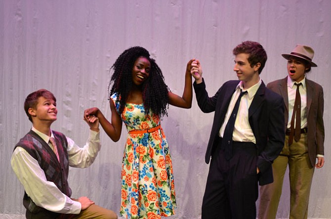 From left, Valentine (senior Graham Morriss) and Proteus (senior Scott Burrows) vie for the hand of the beautiful Sylvia (senior Grace Duah). Proteus’s outraged girlfriend Julia (senior Brittany Padgett) looks on as she stalks him, in drag, in the West Springfield High School Drama production of Shakespeare’s comedy “The Two Gentlemen of Verona.”