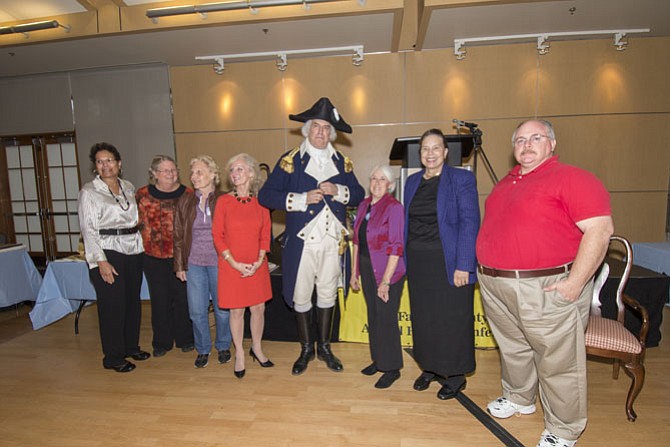 Fairfax County History Commission members (from left) Phyllis Walker Ford, Mary Lipsey
Carole Herrick (Chairman of the FCHC Commission), Lynne Garvey-Hodge (Chairperson of the Conference and Awards Committees, FCHC Commission), Gen. George Washington (aka Dean Malissa), Sallie Lyons, Jenee Lindner and Mike Irwin.

