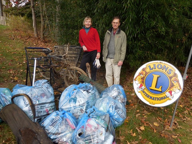 Volunteers Helen (left) and Don Fransell (right) of Mason Neck worked with the Mason Neck Lions Club to clean up a section of Pohick Creek in Lorton.
