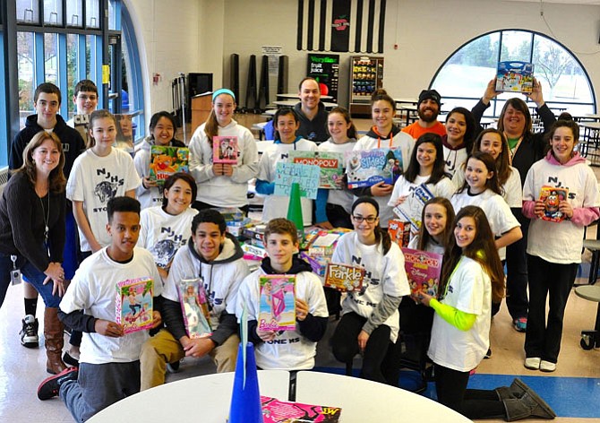 Members of Stone Middle School’s National Junior Honor Society at last year’s Panther Drop-Off with gifts donated to Our Neighbor’s Child.
