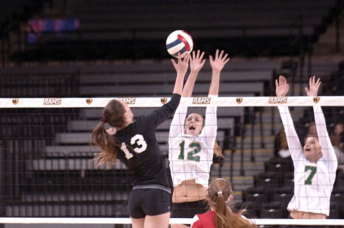 Langley sophomore Elena Shklyar (12) totaled 16 kills, 18 assists and seven blocks against Madison in the 6A state final on Nov. 20 at VCU’s Siegel Center in Richmond.