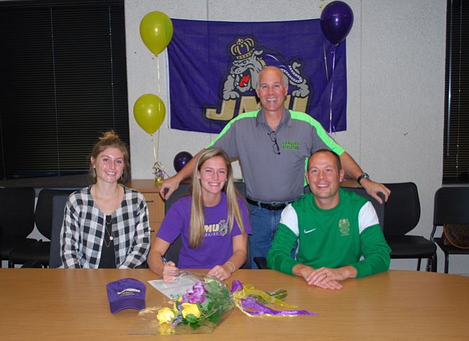 Langley senior Halle Duenkel on Nov. 13 signed a National Letter of Intent to play lacrosse at James Madison University. Pictured from left: Langley lacrosse coach Maggie Kovacs, Duenkel, Principal Fred Amico and DSA Geoff Noto.
