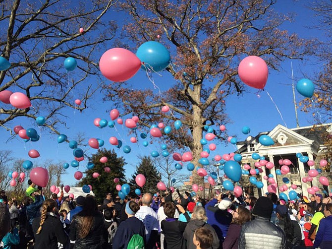 Hundreds of biodegradable balloons are released at the Jennifer Bush-Lawson Foundation’s Memorial 5k Run.
