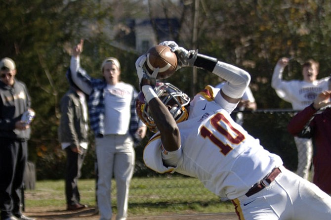 Bishop Ireton receiver Corey Johnson attempts to bring down a pass in the end zone during Saturday’s state championship game against Benedictine. Johnson was ruled out of bounds.