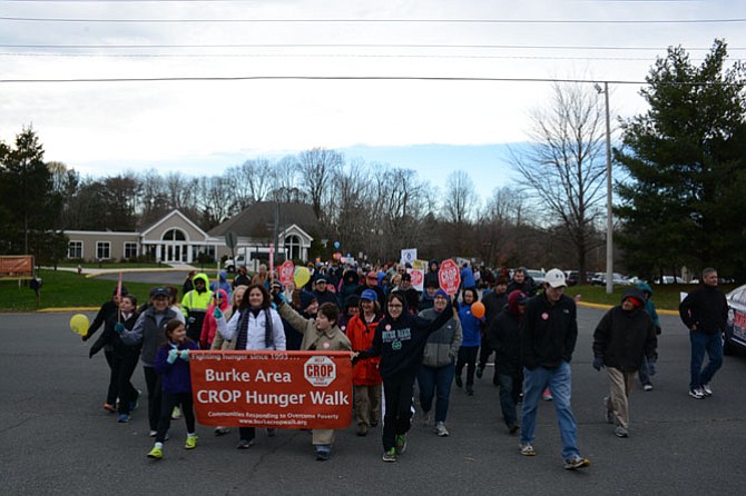 Walkers begin their 3.7-mile journey from Living Savior Lutheran Church in Fairfax Station by crossing Ox Road with help from Fairfax County Police from the West Springfield station.