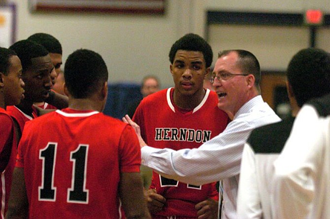 Head coach Gary Hall and the Herndon boys’ basketball team in December. 