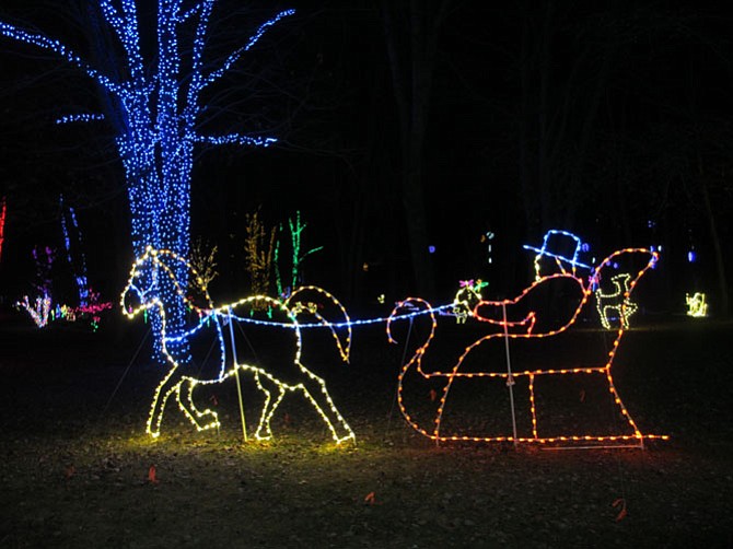 Vignettes throughout the gardens and lakeside bring holiday magic to life at Meadowlark Botanical Gardens in Vienna.
