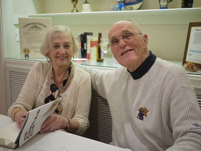 Bill Neikirk and his wife Ruth welcome reception guests as he signs copies of his novel, “The Copperhead Club.” 
