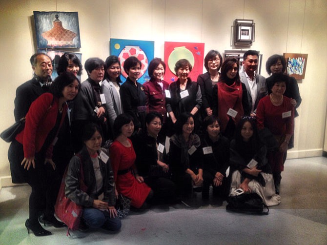Members of the Han-Mee Artists Association of Greater Washington (HMAA) gather for a photo at ArtSpace Herndon. The group has an exhibit of 32 artist at the Herndon art gallery until Jan. 10, 2016.
