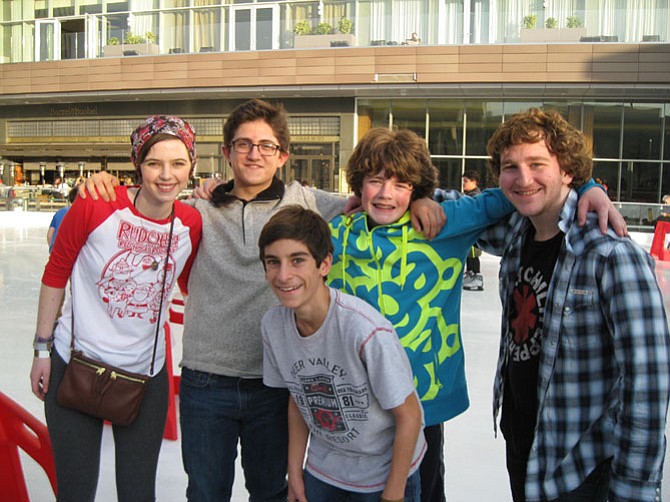 Enjoying ice skating at Tysons Corner Mall rink are (from left); Cathy Onsi, Diego Serrano, Hayden Byrnes, Josh Steiner, and Nick Annunziata of McLean, who was hosting his friends from Maryland and D.C. before exams next week. 
