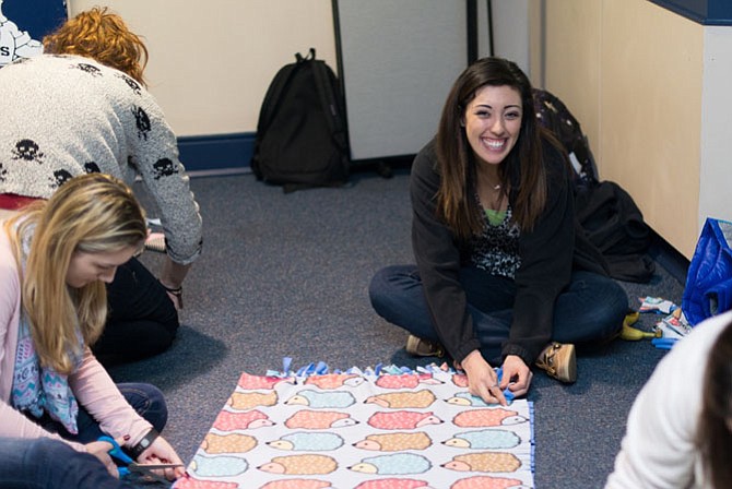 Sydney Stryker and Julianna Jaime at work making baby blankets.
