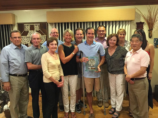 The Friends of the Potomac Community Center Allan Cohen, Steven Landsman, Svetlan Chloupek, David Wanicur, Jill Lavin, Gary Albert, Larry Chloupek, Henry Leung, Penny Heltzer, Jeani Haven, and Herman Yeh in front of Emma Barlock who is the new treasurer.  
