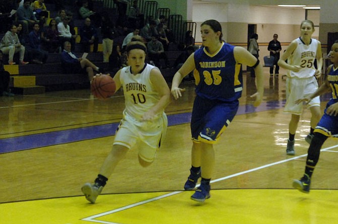 Lake Braddock junior Bailey Edwards, left, scored 13 points during the Bruins’ 42-34 victory over Robinson on Dec. 11.
