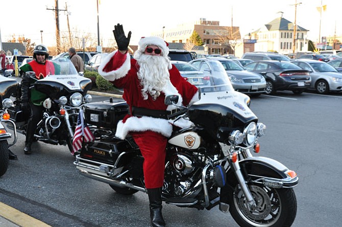 Officer Bob Ladany dresses up each year as Santa and rides his Harley throughout Montgomery County, escorted by Mrs. Claus, his elves and 40 uniformed officers. They were collecting donations for The Children’s Inn at the National Institutes for Health. 
