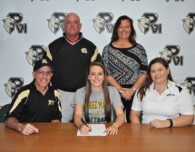 Aker is pictured with her parents Mike and Jackie Aker and Paul VI softball coaches Patti Hinko and EJ Thomas. 