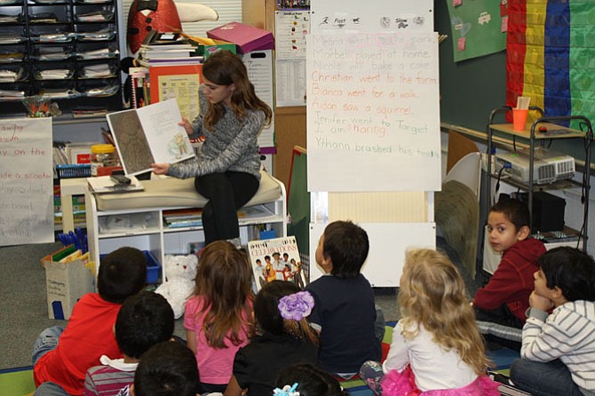 Taylor Betts reads the kindergartners a gingerbread story.