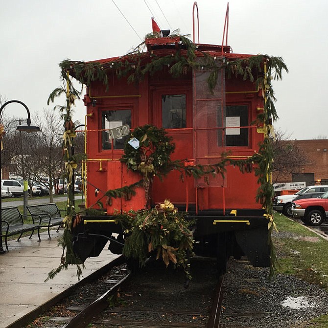 The red caboose, permanently stationed in the Historic Church Street Corridor, is decked out in festive greens crafted by the Ayr Hill Garden Club. The Optimist Club of Greater Vienna maintains the caboose.
