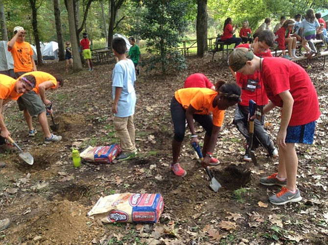 Digging fire pits for the Dutch ovens. 
