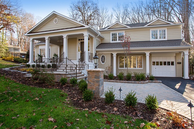 The new front elevation to the Torre home is done in neoclassical themes that respond to an enlarged floor plan incorporating both a 300-square-foot addition and a spacious front veranda.
