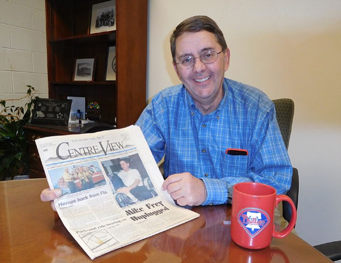 Michael Frey with his Phillies mug and a 1998 Centre View featuring a story on him.
