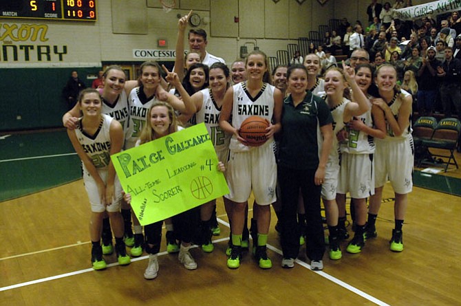 Senior guard Paige Galiani, with ball, became the Langley girls’ basketball program’s all-time leading scorer during a Jan. 8 game against McLean. Galiani finished with four points, giving her 1,157 for her career.