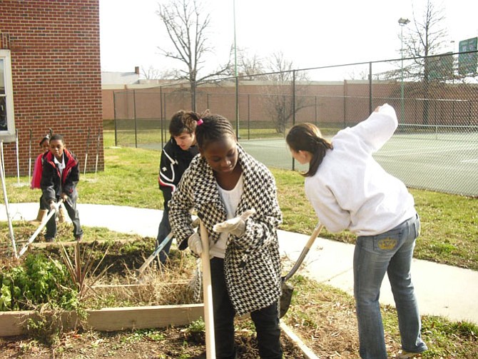 Community Garden upkeep during a previous Martin Luther King Jr. summit.
