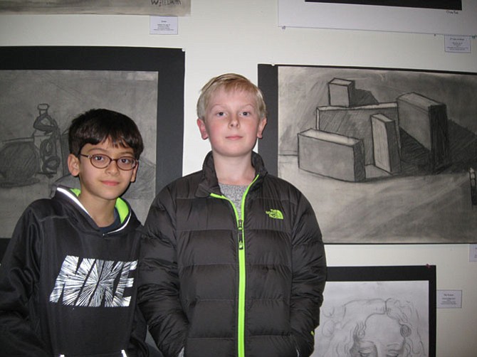 Rohaan Sindhwani, 10, and Preston Brown, 10, both of Great Falls, with their art work.
