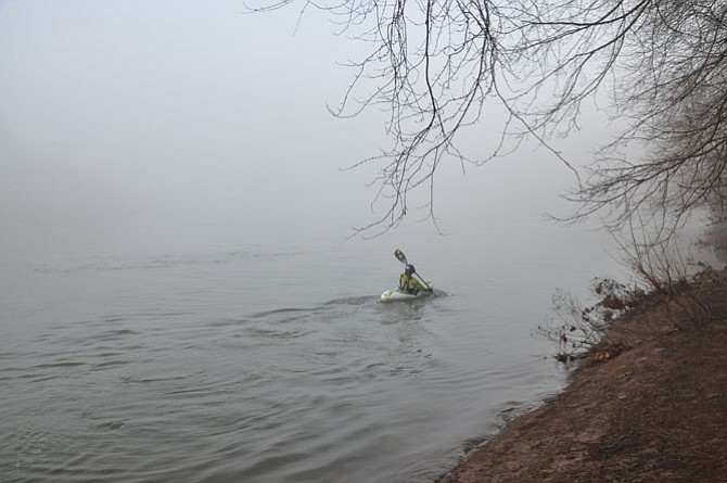 Angre Azuban starts a trip in his kayak on the foggy Potomac River on Saturday morning, Jan. 16. 
