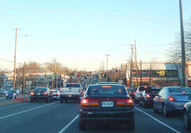 Late Monday afternoon traffic on Route 50 east heads toward the Kamp Washington intersection.
