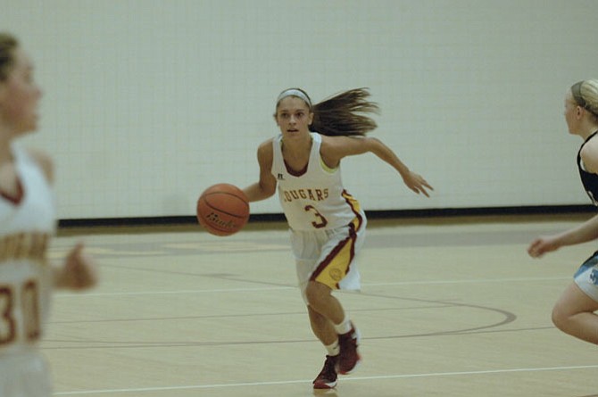 Oakton senior guard Alex Marquis scored her 1,000th career point on Feb. 1 during a 47-34 win over Centreville at Oakton High School.