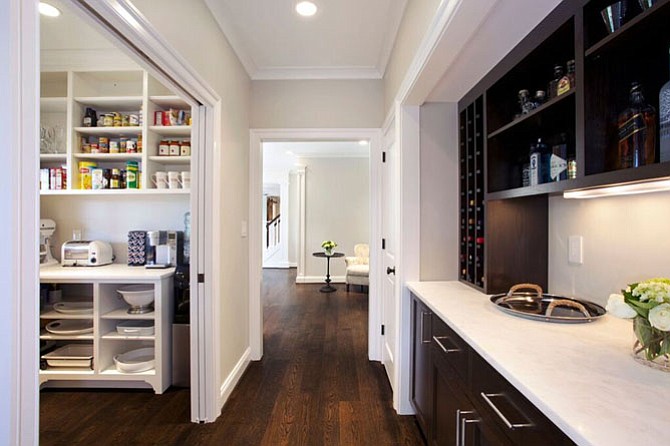 Rill Architects designed this butler’s pantry in Potomac, Md., with pocket doors. 
