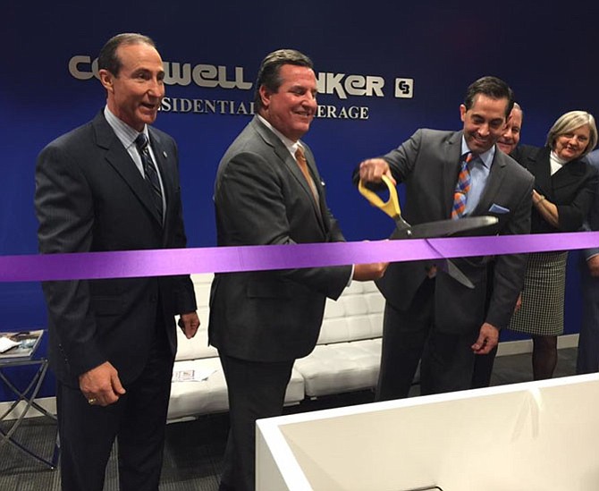 Cutting the ribbon (from left) are Mark Ingrao, president and CEO of Greater Reston Chamber of Commerce, Rick Hoffman, senior regional vice president, Mid-Atlantic, Coldwell Banker Residential Brokerage, Kelly Breeze, Branch vice president, Reston Town Center, Coldwell Banker Residential Brokerage, Dave Adams and JoAnne Adams of the Dave and JoAnne Adams Group who are members of the Greater Reston Chamber of Commerce and a Coldwell Banker Residential Brokerage affiliated sales team.
