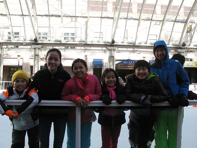 Family members, from right, Kingston Ho, Vivian Cao-Dao, Kathleen Pham, Alice Cao-Dao, Brian Dao and Danny Pham skate together. “It’s a good place to meet and hang out,” Vivian Cao-Dao said. “Even if you’re a beginner, it’s OK, because everyone falls.”
