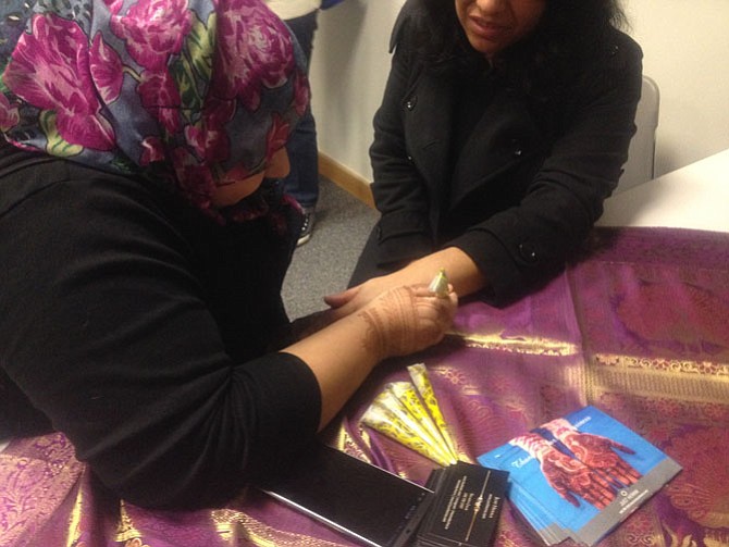 Henna hand artist Shazia Jalil attended A Taste of the Arab World event at Reston Hunters Woods Friday, Feb. 12. Reston Community Center brings the community together through enriching time experiences. 
