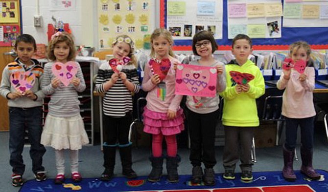 Churchill Road kindergarteners in Barbara Lewis’ class were proud of the valentines they made during their service learning project, “Valentines for Vets.”  From left are:  Joseph Leavitt, Anna Newell, Adriana Chemel, Alex Eggers, Emily Foley, Nico Zacarria and Emma Kry.
