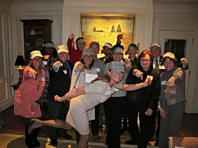 Brooke Curran, front, celebrates Feb. 10 with recipients after awarding $70,000 in Move2Learn grants to 12 nonprofits through the RunningBrooke fund.
