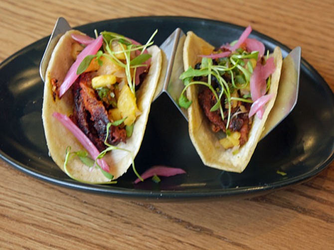 One of Chef Graham Duncan's favorite small plates at Palette 22 in Shirlington is the Tacos Al Pastor on the "By 2's" menu. These come two per order and include: achiote marinated pork, charred onions, and pineapple salsa. Duncan likes the smoky flavors and has created the portion size to be satisfying but to leave room for more tastes. 
